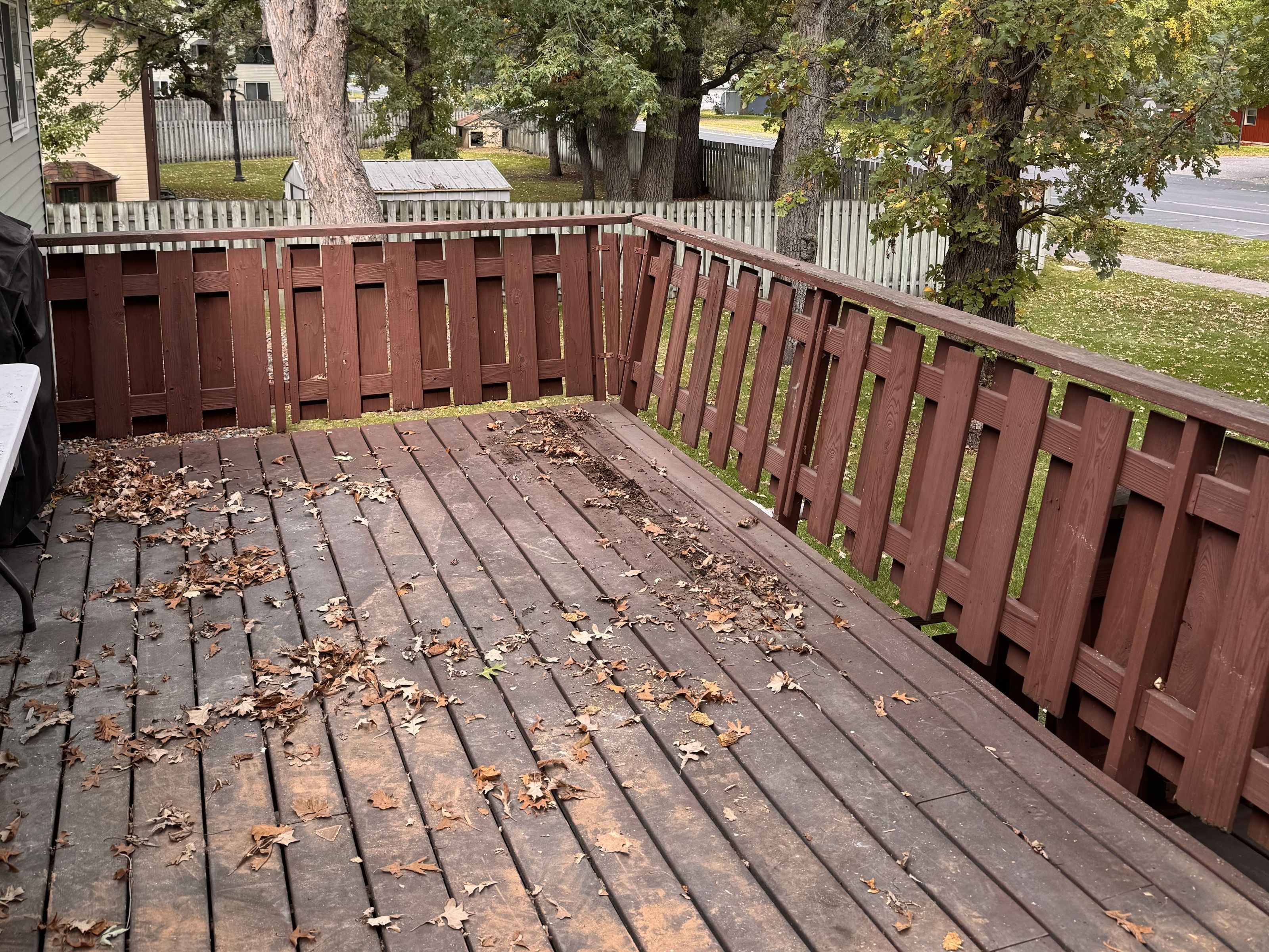 Backyard deck swept clear after a torn-out kitchen was hauled away