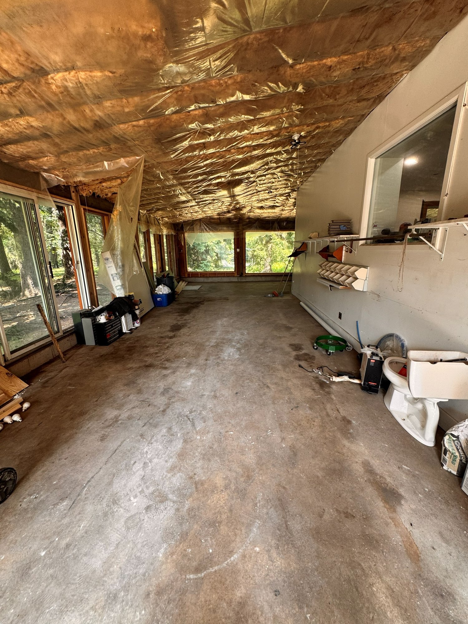 Swept and emptied sunroom after a full house cleanout