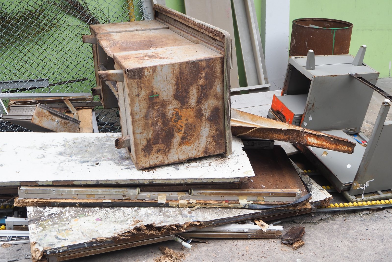 Rusted metal and mixed demolition debris in a pile